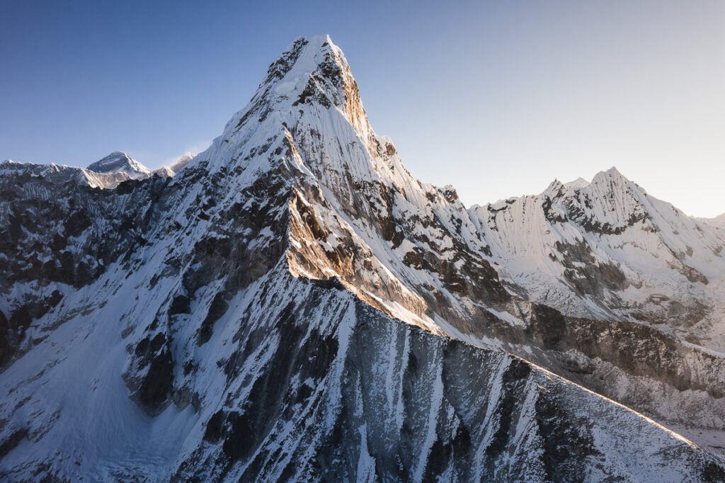 a very tall mountain with a lot of snow on it