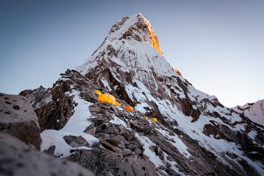 a very tall mountain covered in lots of snow