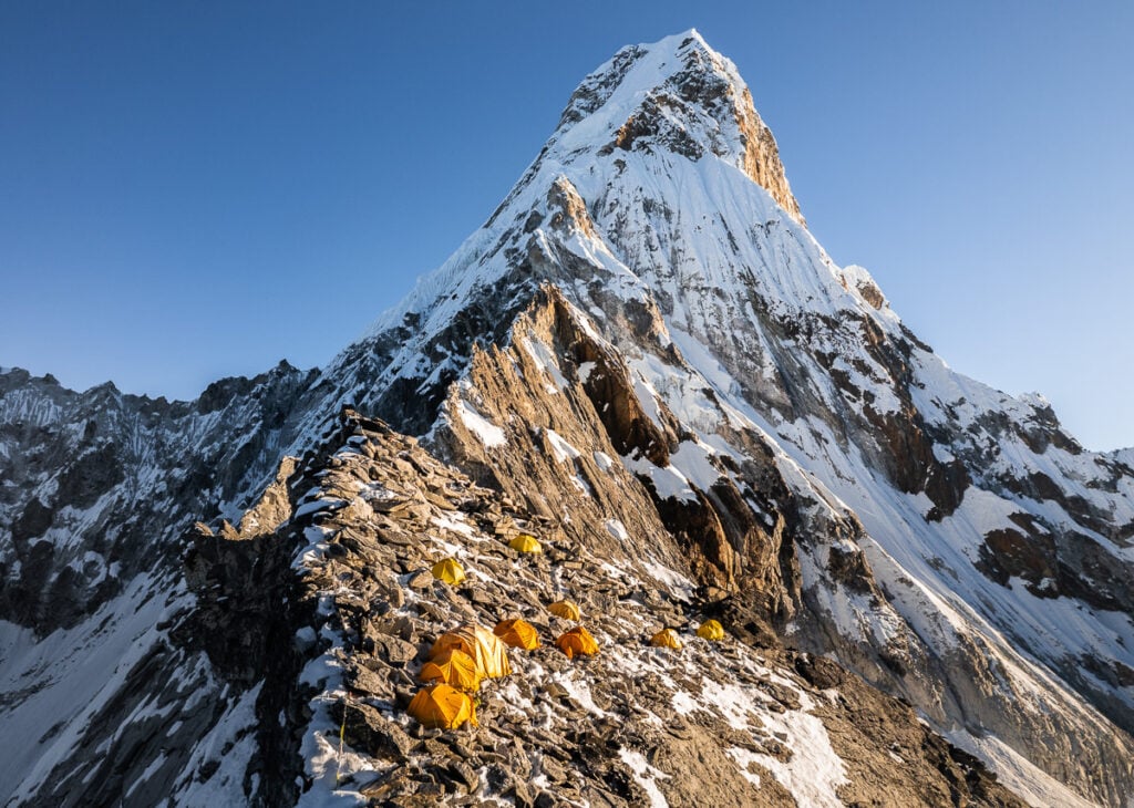 a very tall mountain covered in lots of snow