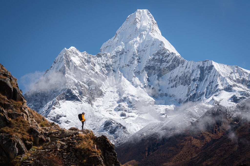 a person standing on top of a mountain