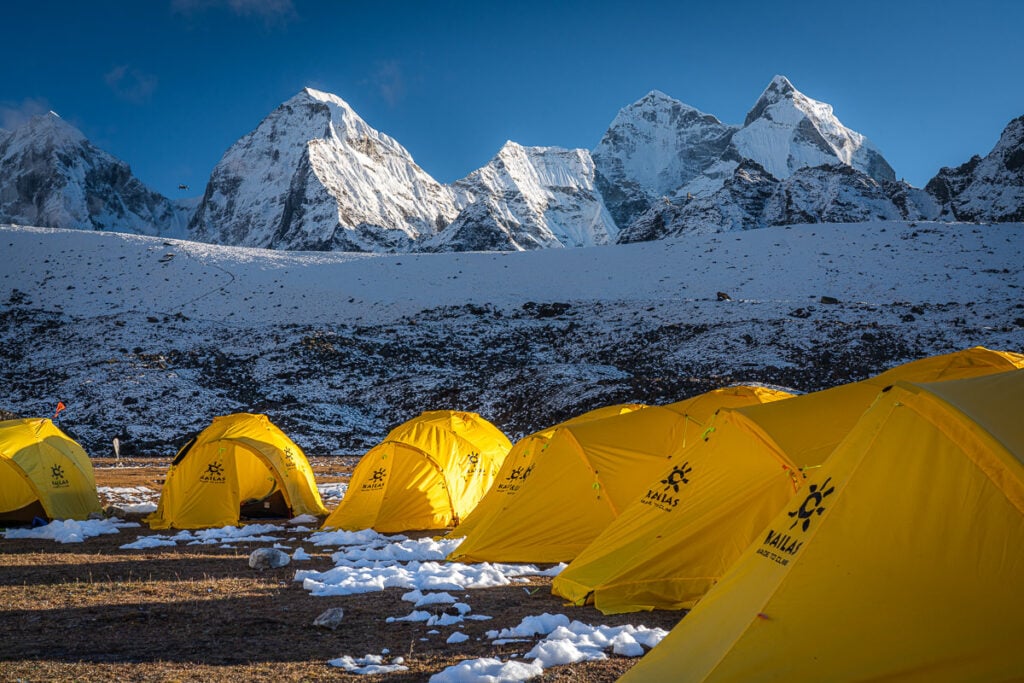 a group of tents pitched up in the snow