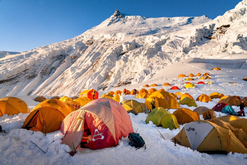a group of tents pitched up in the snow