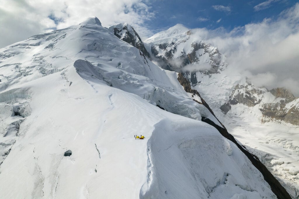a person skiing down a snowy mountain side