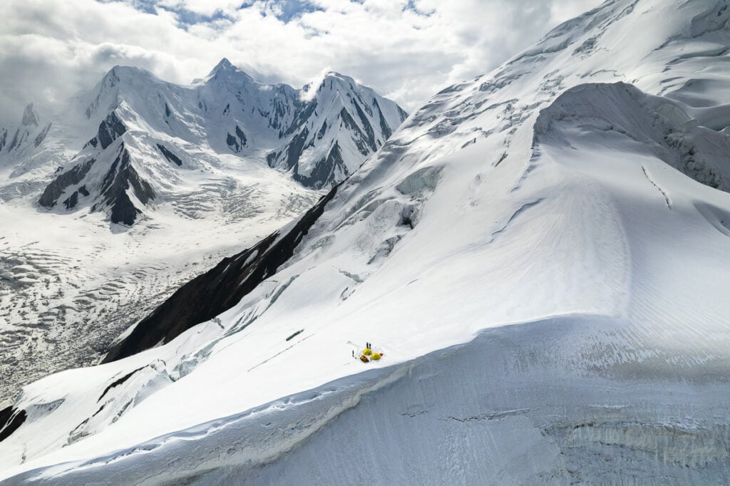 a person skiing down a snow covered mountain
