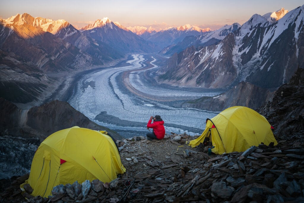 a couple of tents sitting on top of a mountain