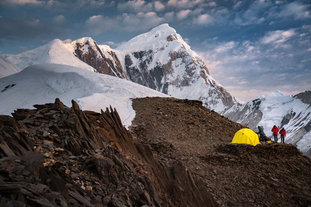 a group of people standing on top of a mountain